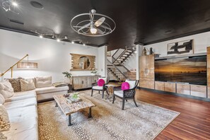 Lower Level Family Room with large tv and bar!