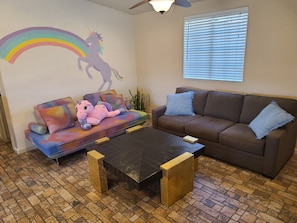 Living room with unicorn mural