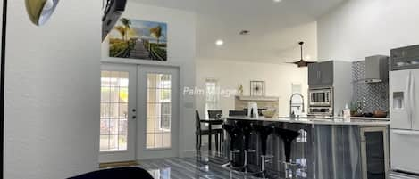 Porcelain floors with a Wine Cooler, Bar Stools Pop up wireless charger + more!