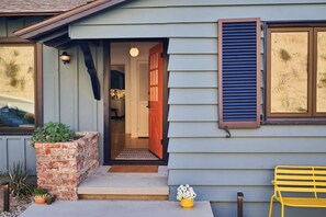 Welcoming front entrance with benches for friendly conversation