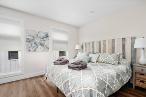 【Bedroom 1 of 2】Featuring a King bed with modern finishes