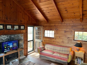 Living room with door to deck