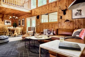 Large main living room with 70" 4K TV & 50" TV.