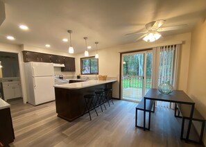 Clean and bright kitchen with deck off the back for dining and relaxing.