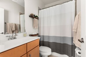 Full bathroom connected to Bedroom 1