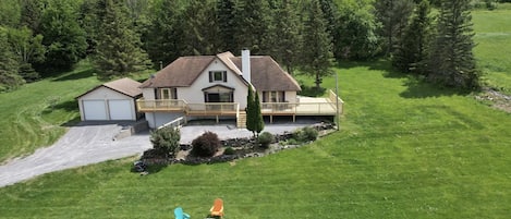 Brand new wrap around porch w/ hot tub, outdoor firepit w Adirondack chairs. 