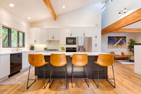 Updated, luxe kitchen with extra seating at the kitchen island