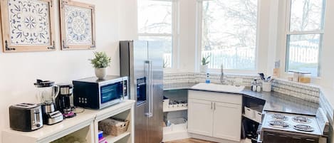 Kitchen with views out to wooded area