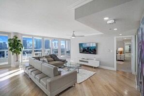 Living area, Roku streaming tv, balcony access, view into master bedroom