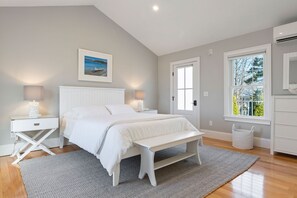 Comfortable queen-size bed with beautiful white linens, and ensuite bathroom. 