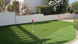 Mini-golf, putting green to side of villa for budding golfers or just family fun