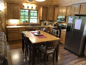 Fully outfitted kitchen and dining area