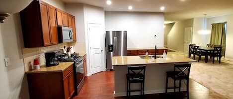 Full Kitchen and dining room with six chairs dining table. 