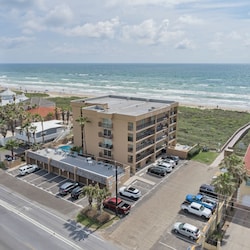 Aerial view of the complex. Beach access is located in the parking lot.