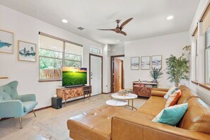 Soundbar with 60" smart TV. Solid wood fan ceiling fan and marble coffee table