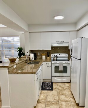 Fully equipped kitchen with granite countertops