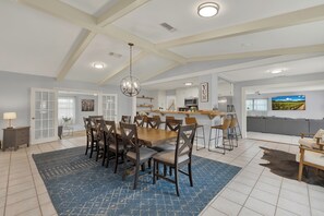 The spacious open-concept kitchen and dining area provide the perfect setting to gather with friends and family while preparing a delicious meal.