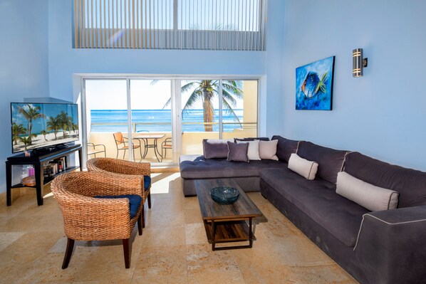 Living area with soaring ceilings and plenty of natural light
