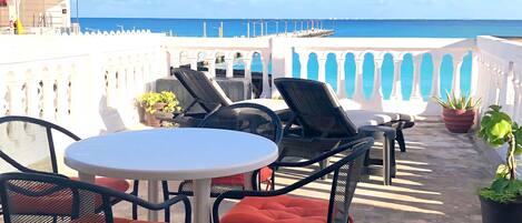 Sip your morning coffee on the balcony and take in the enchanting ocean waves for a perfect coastal morning.