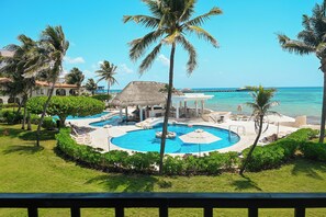 Take a dip in Xaman Ha’s stunning swimming pool, just steps away