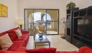 Bright & comfortable living area with sliding doors to the terrace
