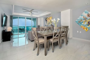 Enjoy your meal in this lovely dining table and chairs with ocean views.