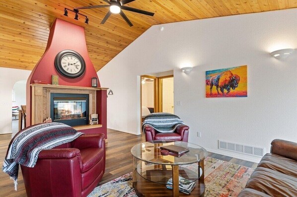Style meets warmth with a striking fireplace and vibrant decor—your perfect retreat awaits!