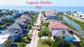 Steps from the Shore! Discover your dream coastal escape in this charming beachside home with ocean views, just a stroll away from the serene Gulf waters. Ideal for families or couples seeking sun-soaked relaxation.