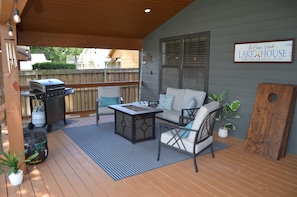 Outdoor living area with fire pit and propane grill