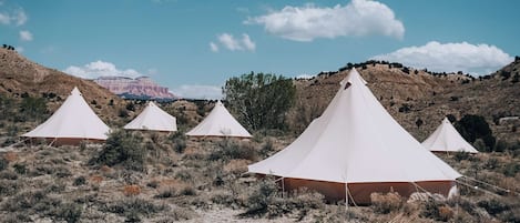 A view of our bell tents with the mountains in the distance at our Bryce Canyon location.