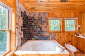 Jet tub with its own hot water tank so you  have plenty of hot water. 