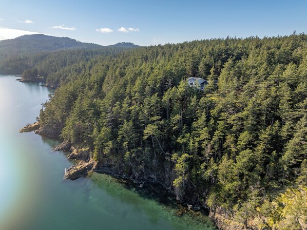 Waterfront adventures.  Follow our winding trail down through five private acres to a private sandy beach and rock outcrop.  
