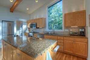 Open, bright kitchen for meals and coffee.