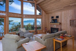 The Great Room with elevated windows that bring the sea and islands inside.