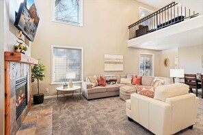 Great room with 30 foot ceiling and open to 2nd level loft