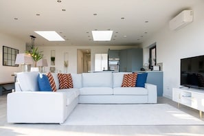 This comfortable l-shaped sofa is the centrepiece of the open design living area