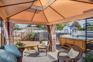 Pergola, hot tub, pool and deck