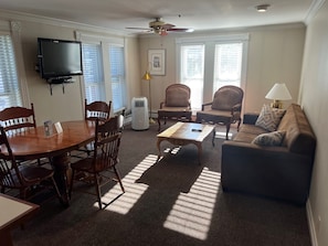 Living / Dining Room on Main St w/pull out couch.