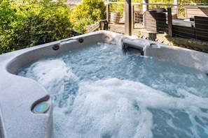 Hot tub on lower level overlooking the city.