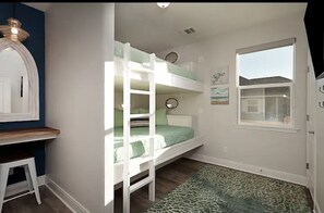 Green 2 Queen Bunk room with vanity and 55 inch smart tv