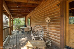 Front porch has grill and dining table to seat 6 people.
