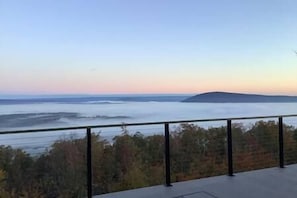 Back deck. The fog hanging low with a sunrise.