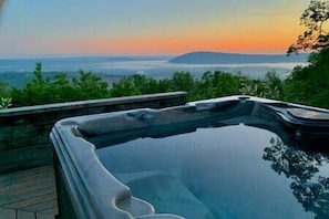 Hottub overlooking the river and beautiful mountain scenery.