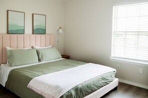 Our second bedroom has features a hotel-like queen sized bed with cotton duvet covers and fluffy pillows.  We offer a variety of pillows in our properties in case our guests like something firmer or flatter, or fluffier!