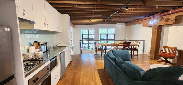 Cool New York loft style vibes. Open plan living, dining and kitchen