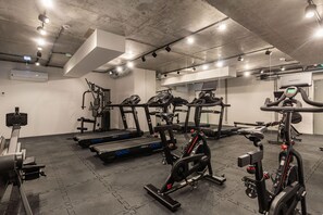 A gymnasium with exercise equipment such as running treadmills and stationary bikes.