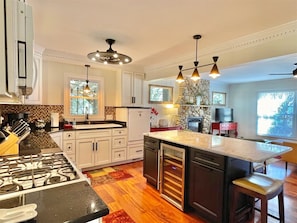 Beautiful well-equipped kitchen with island and beverage cooler