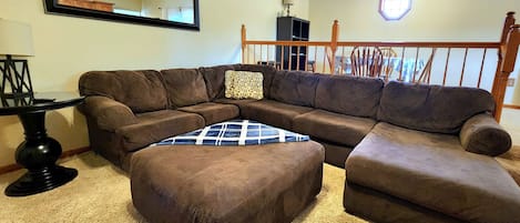 Living Room w/large sectional and Roku TV