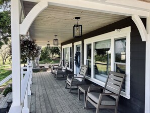 Front porch with incredible views. 4 rocking chairs to relax on.