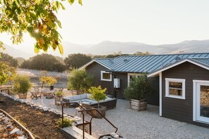 Rear garden with dining and 2 seating areas
